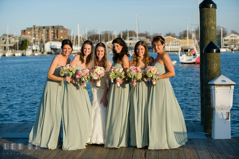 Bride, Maid of Honor and Bridesmaids posing on the Annapolis downtown dock. Historic Inns of Annapolis Maryland, Governor Calvert House wedding, by wedding photographers of Leo Dj Photography. http://leodjphoto.com