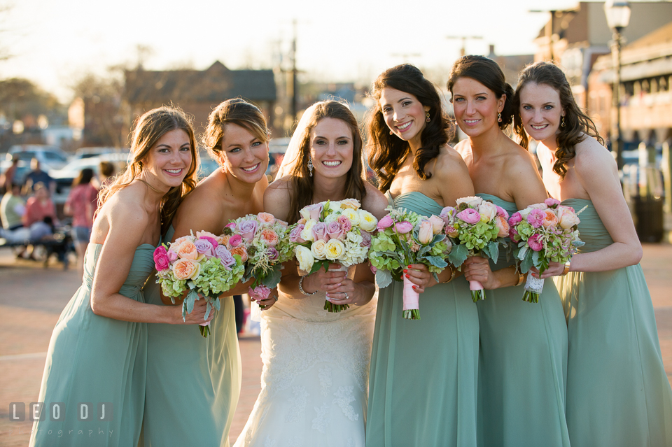 Bride and her Bridal party posing at the Annapolis downtown harbor. Historic Inns of Annapolis Maryland, Governor Calvert House wedding, by wedding photographers of Leo Dj Photography. http://leodjphoto.com