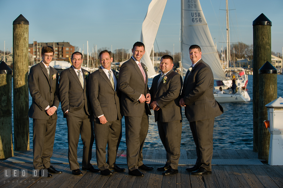 Groom, Best Man, and Groomsman posing on the Annapolis downtown dock. Historic Inns of Annapolis Maryland, Governor Calvert House wedding, by wedding photographers of Leo Dj Photography. http://leodjphoto.com