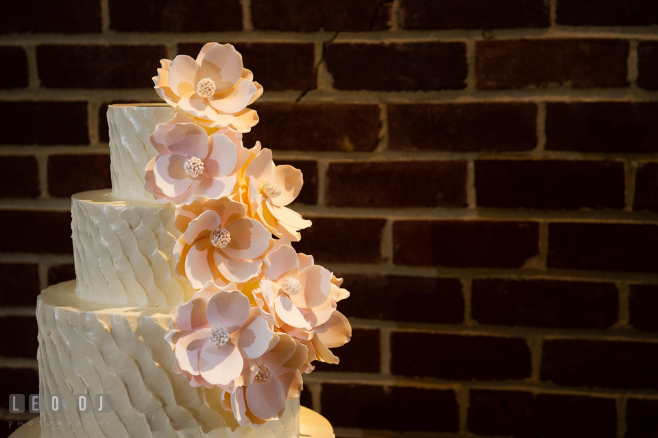 Flowers decorations details on the wedding cake designed by Sugar Baker Cakes. Historic Inns of Annapolis Maryland, Governor Calvert House wedding, by wedding photographers of Leo Dj Photography. http://leodjphoto.com