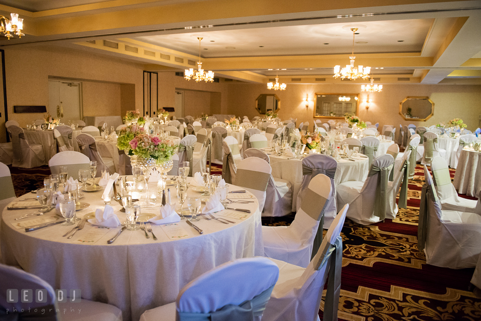 View of Governor's Hall with the guests dining tables and the centerpieces. Historic Inns of Annapolis Maryland, Governor Calvert House wedding, by wedding photographers of Leo Dj Photography. http://leodjphoto.com