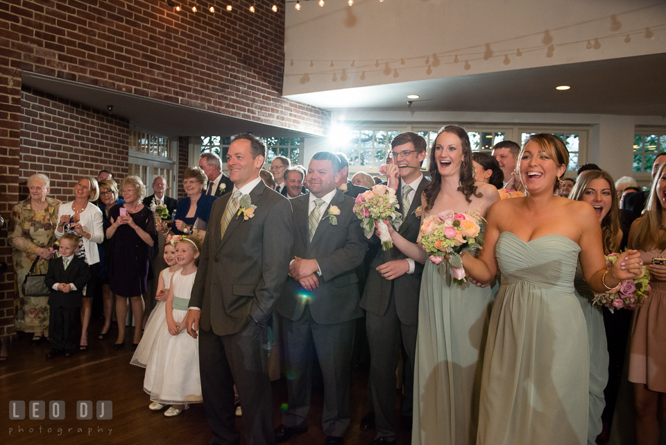 Bridal and Groom's party and all guests laughing and cheering Bride and Groom during the introduction. Historic Inns of Annapolis Maryland, Governor Calvert House wedding, by wedding photographers of Leo Dj Photography. http://leodjphoto.com