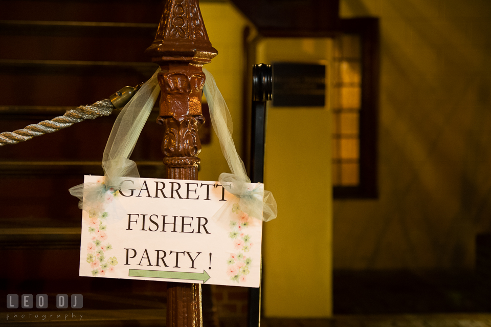 Sign of the Bride and Groom's last name and direction hung at the front of the venue. Historic Inns of Annapolis Maryland, Governor Calvert House wedding, by wedding photographers of Leo Dj Photography. http://leodjphoto.com