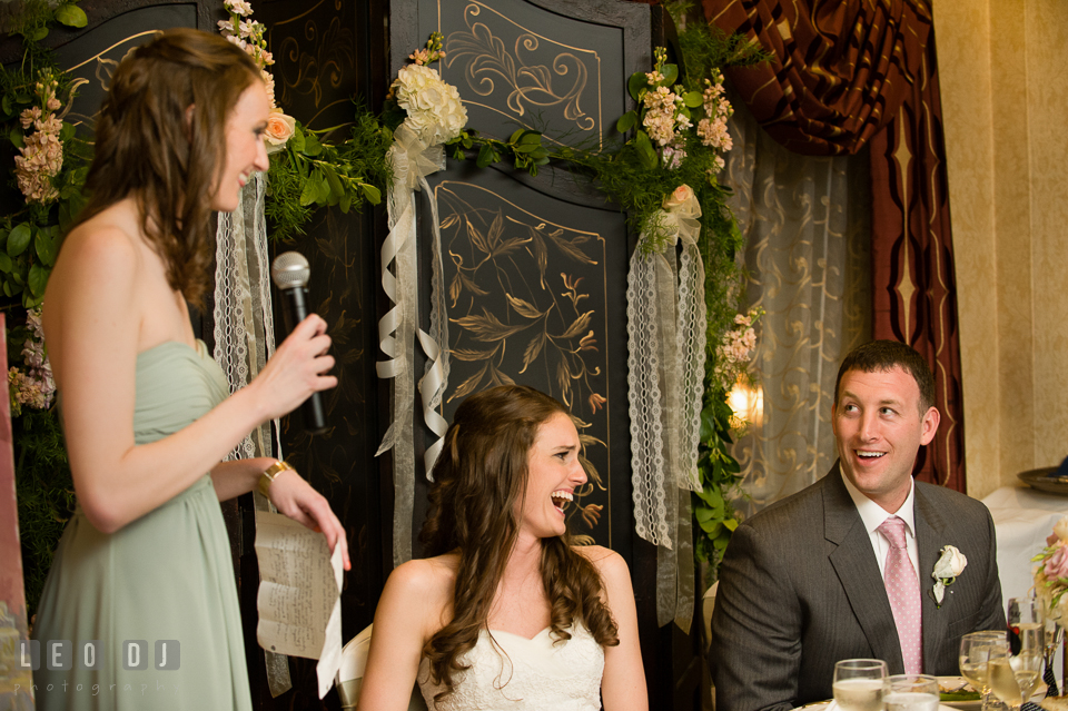 Bride and Groom laughing listening to Maid of Honor's toast speech. Historic Inns of Annapolis Maryland, Governor Calvert House wedding, by wedding photographers of Leo Dj Photography. http://leodjphoto.com