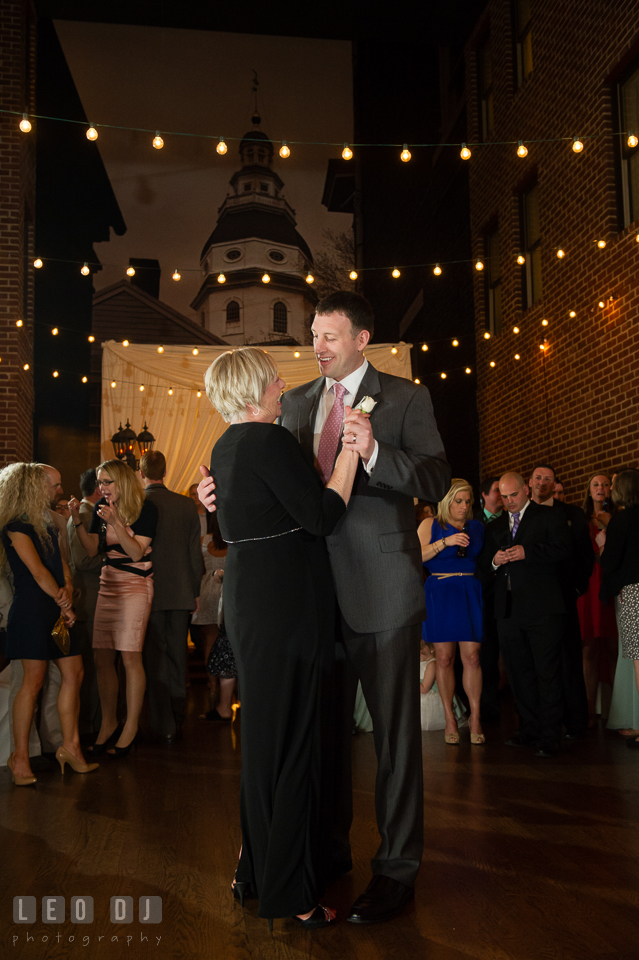 Groom smiling during the Mother and son dance. Historic Inns of Annapolis Maryland, Governor Calvert House wedding, by wedding photographers of Leo Dj Photography. http://leodjphoto.com