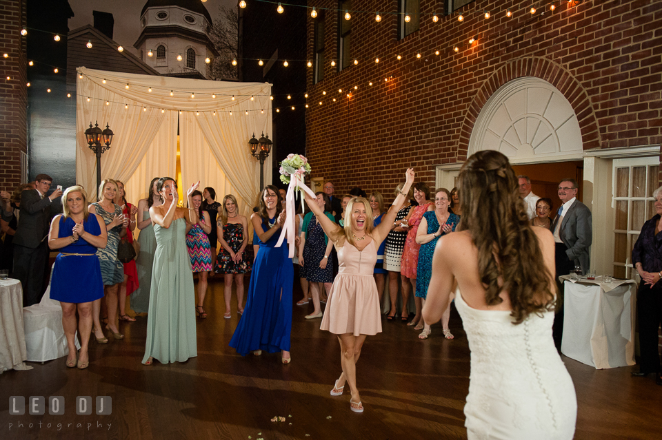 One of the guest happily cheered after she caught the flower bouquet from the toss. Historic Inns of Annapolis Maryland, Governor Calvert House wedding, by wedding photographers of Leo Dj Photography. http://leodjphoto.com