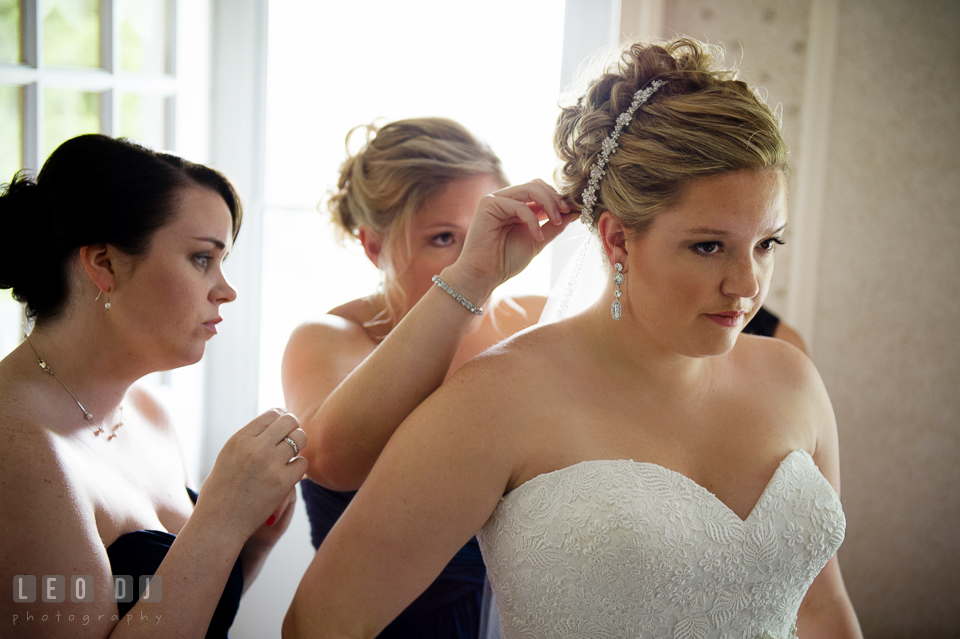 Matron of honor put veil on bride's hair. Kent Manor Inn, Kent Island, Eastern Shore Maryland, wedding ceremony and getting ready photos, by wedding photographers of Leo Dj Photography. http://leodjphoto.com