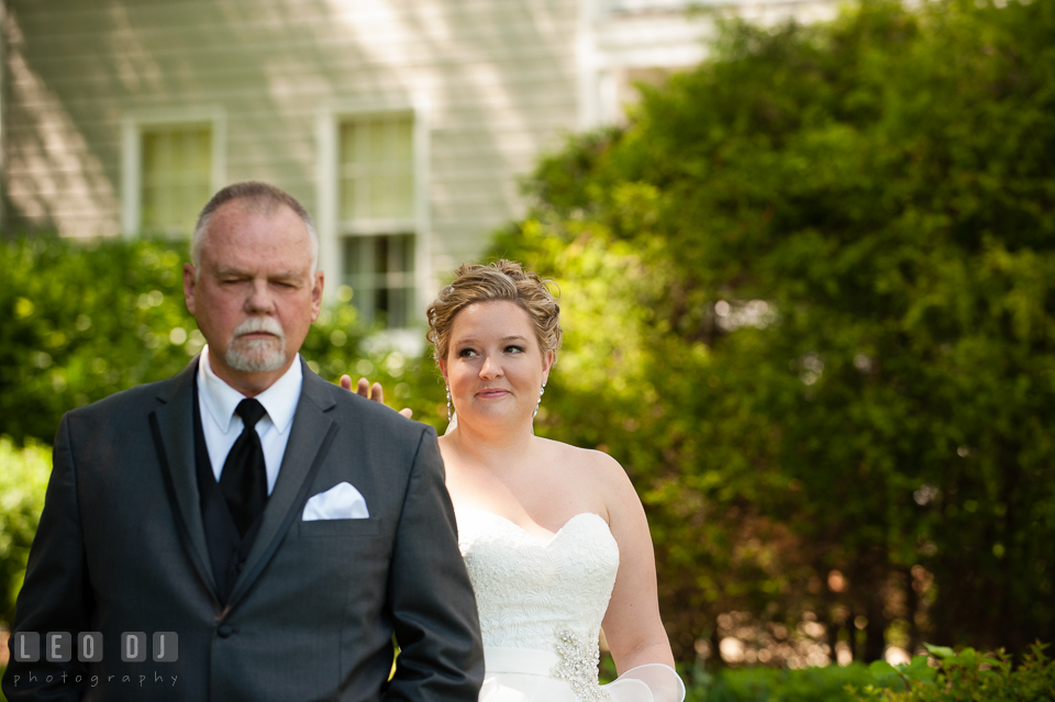 Bride smiled and tap Father's shoulder during first look. Kent Manor Inn, Kent Island, Eastern Shore Maryland, wedding ceremony and getting ready photos, by wedding photographers of Leo Dj Photography. http://leodjphoto.com