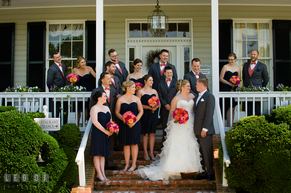 Bride and Groom posing with all the bridesmaids and groomsmen in front of the restaurant. Kent Manor Inn, Kent Island, Eastern Shore Maryland, wedding ceremony and getting ready photos, by wedding photographers of Leo Dj Photography. http://leodjphoto.com