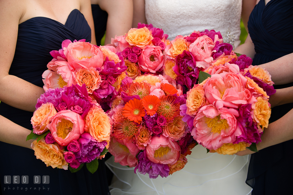 Bride and her Bridal party showing their beautiful flower bouquets designed by Intrigue Design and Decor. Kent Manor Inn, Kent Island, Eastern Shore Maryland, wedding ceremony and getting ready photos, by wedding photographers of Leo Dj Photography. http://leodjphoto.com