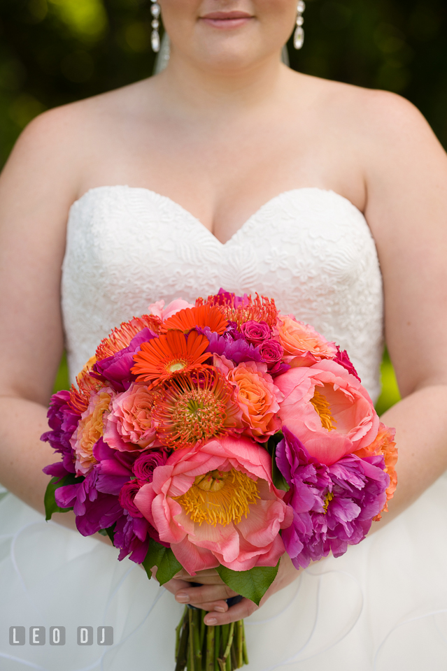 Bride's beautiful flower bouquet - full of peonies, roses, gerberas, and proteas, was designed by Intrigue Design and Decor. Kent Manor Inn, Kent Island, Eastern Shore Maryland, wedding ceremony and getting ready photos, by wedding photographers of Leo Dj Photography. http://leodjphoto.com