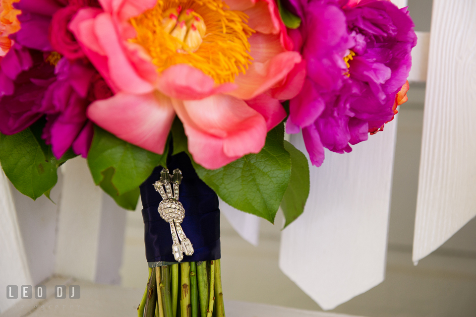 Close up shot of Grandmother's brooch on Bride's gorgeous floral bouquet designed by florist Intrigue Design and Decor. Kent Manor Inn, Kent Island, Eastern Shore Maryland, wedding ceremony and getting ready photos, by wedding photographers of Leo Dj Photography. http://leodjphoto.com