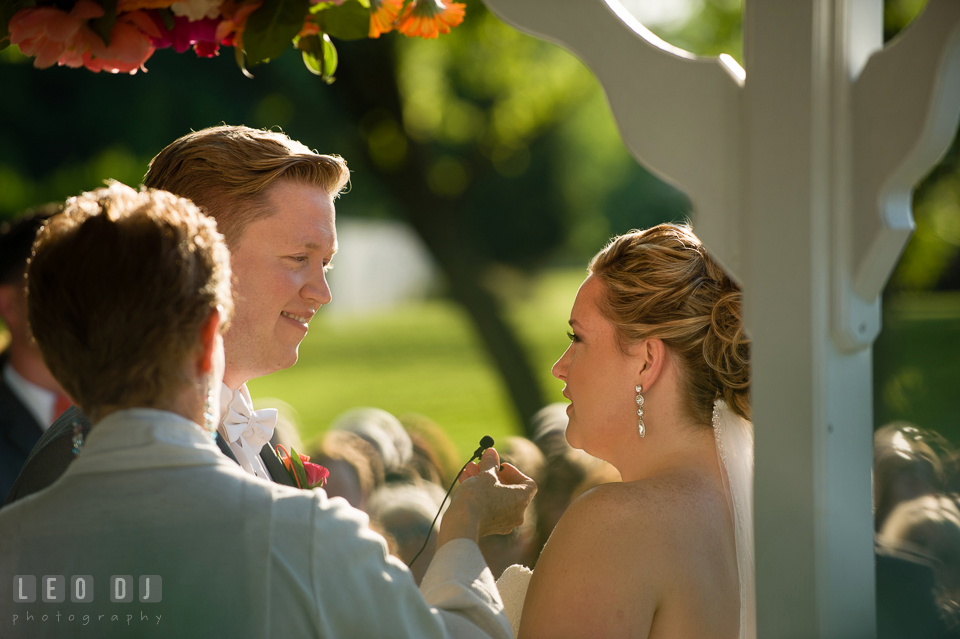 Bride and Groom reciting their vows and exchanging wedding rings. Kent Manor Inn, Kent Island, Eastern Shore Maryland, wedding ceremony and getting ready photos, by wedding photographers of Leo Dj Photography. http://leodjphoto.com