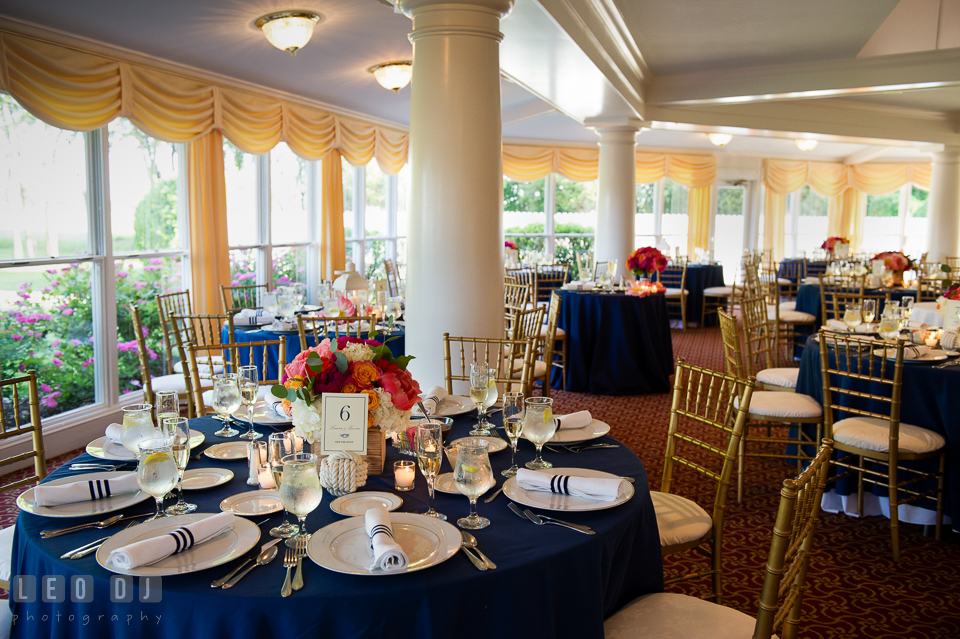 Table setting with the vibrant colored flowers for the centerpiece by Intrigue Design and Decor. Kent Manor Inn, Kent Island, Eastern Shore Maryland, wedding reception and ceremony photo, by wedding photographers of Leo Dj Photography. http://leodjphoto.com