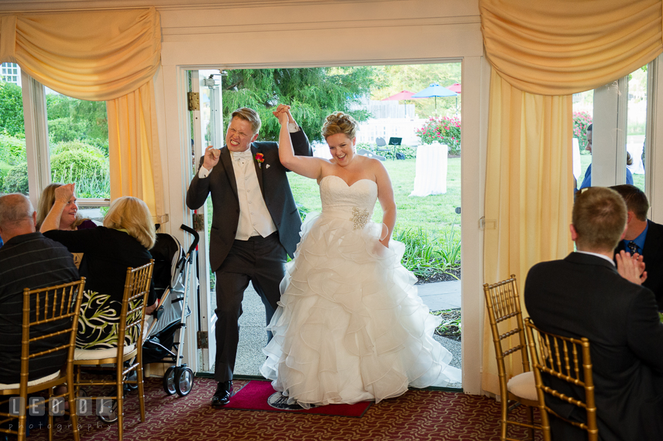 Bride and Groom entering the ballroom during introduction, accompanied by their favorite tune, "I Got a Feeling" by the Black Eyed Peas. Kent Manor Inn, Kent Island, Eastern Shore Maryland, wedding reception and ceremony photo, by wedding photographers of Leo Dj Photography. http://leodjphoto.com