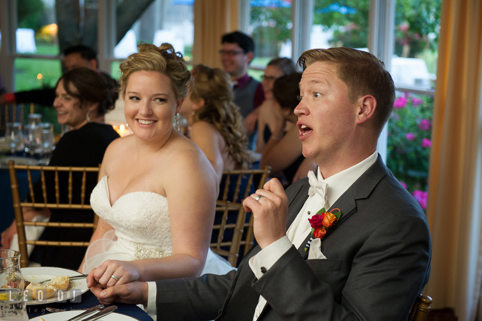 Bride and Groom smiling and commenting Matron of Honor's toast speech. Kent Manor Inn, Kent Island, Eastern Shore Maryland, wedding reception and ceremony photo, by wedding photographers of Leo Dj Photography. http://leodjphoto.com