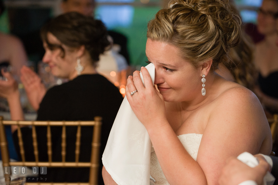 Bride wiping tears, touched by Best Man's toast speech. Kent Manor Inn, Kent Island, Eastern Shore Maryland, wedding reception and ceremony photo, by wedding photographers of Leo Dj Photography. http://leodjphoto.com