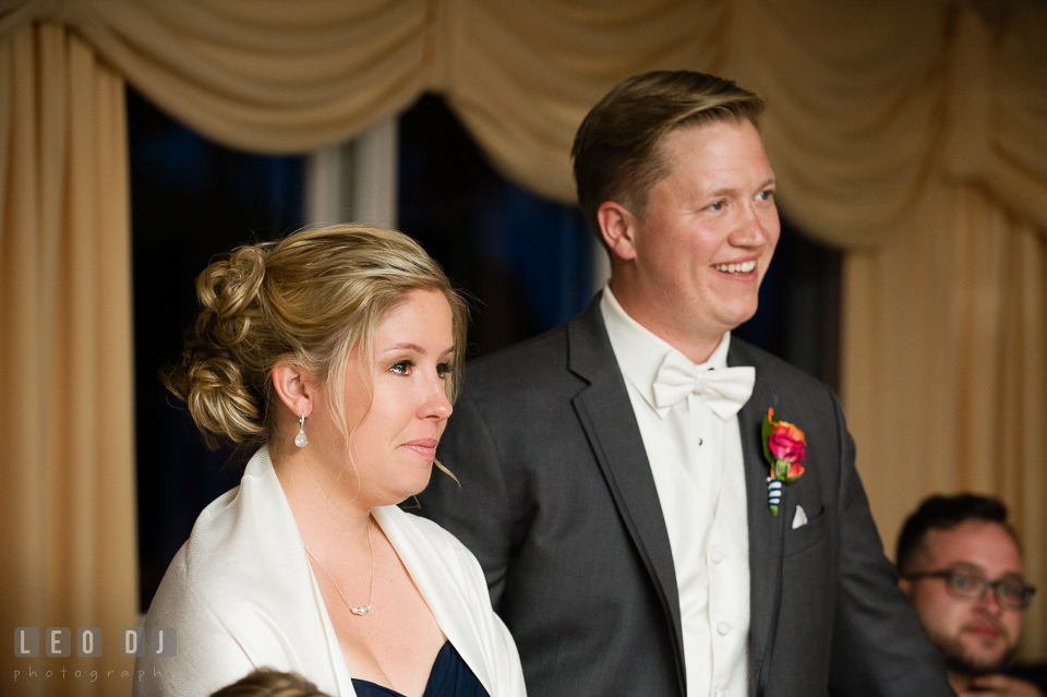 Sister of Bride and Groom smiling and shedding tear watching Bride danced with father. Kent Manor Inn, Kent Island, Eastern Shore Maryland, wedding reception and ceremony photo, by wedding photographers of Leo Dj Photography. http://leodjphoto.com