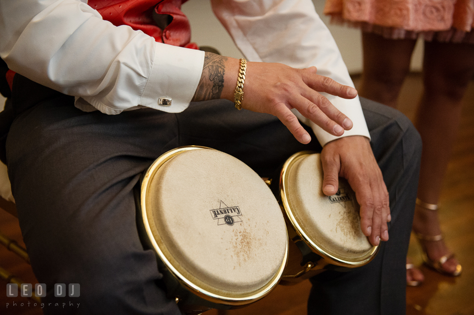 Best man playing bongo drums for the Bride and Groom. Kent Manor Inn, Kent Island, Eastern Shore Maryland, wedding reception and ceremony photo, by wedding photographers of Leo Dj Photography. http://leodjphoto.com