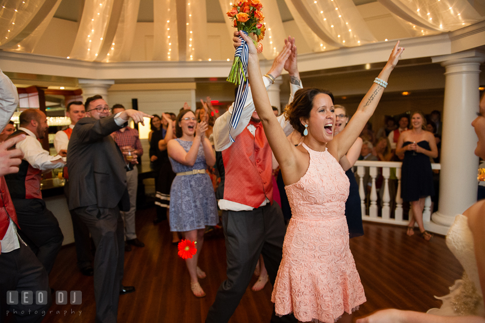 One of the guests cheered after she caught the flower bouqet the bride threw. Kent Manor Inn, Kent Island, Eastern Shore Maryland, wedding reception and ceremony photo, by wedding photographers of Leo Dj Photography. http://leodjphoto.com