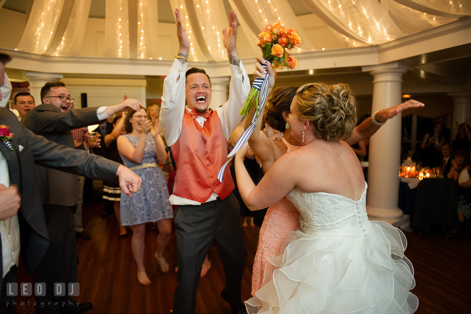 Bride hugged girl that caught the bouquet and Best Man cheered. Kent Manor Inn, Kent Island, Eastern Shore Maryland, wedding reception and ceremony photo, by wedding photographers of Leo Dj Photography. http://leodjphoto.com