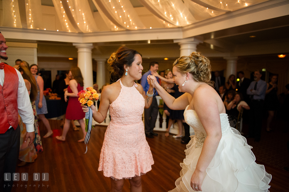 Bride congratulated the winner of bouquet tossing. Kent Manor Inn, Kent Island, Eastern Shore Maryland, wedding reception and ceremony photo, by wedding photographers of Leo Dj Photography. http://leodjphoto.com