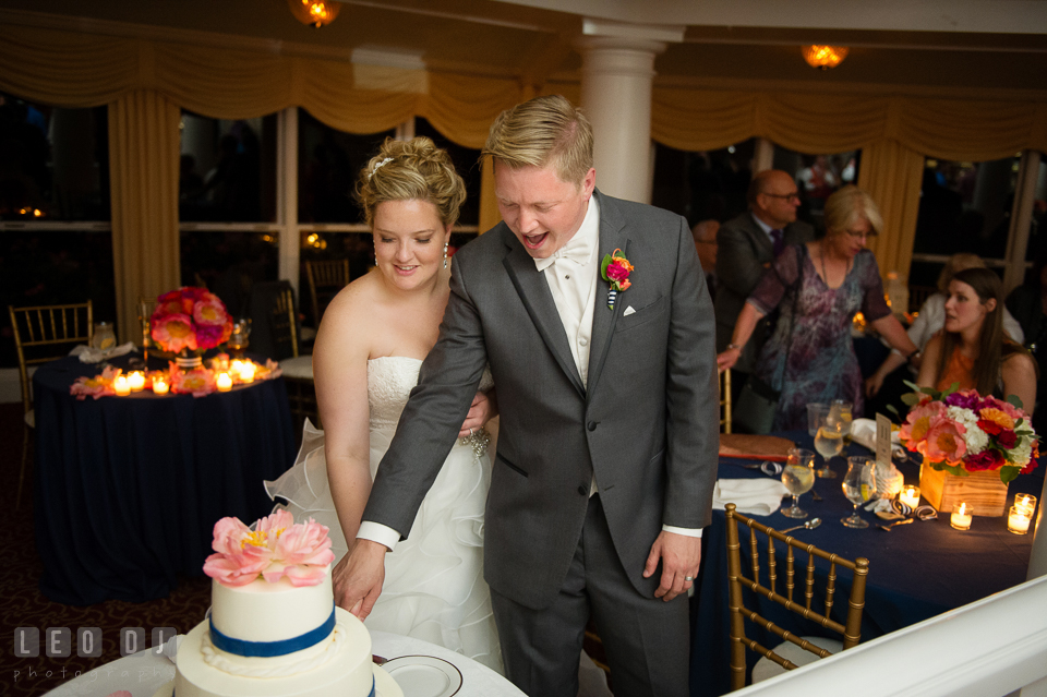 Bride and Groom cutting wedding cake by Sugar Bakers. Kent Manor Inn, Kent Island, Eastern Shore Maryland, wedding reception and ceremony photo, by wedding photographers of Leo Dj Photography. http://leodjphoto.com