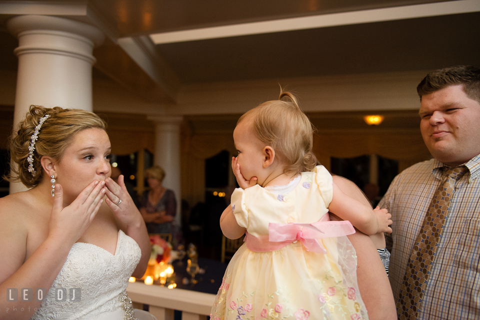 Bride and baby trying to blow kisses together. Kent Manor Inn, Kent Island, Eastern Shore Maryland, wedding reception and ceremony photo, by wedding photographers of Leo Dj Photography. http://leodjphoto.com