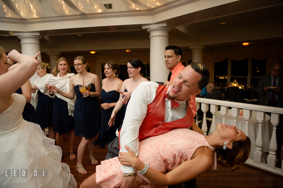 Best man doing the dip to girlfriend during open floor dance. Kent Manor Inn, Kent Island, Eastern Shore Maryland, wedding reception and ceremony photo, by wedding photographers of Leo Dj Photography. http://leodjphoto.com