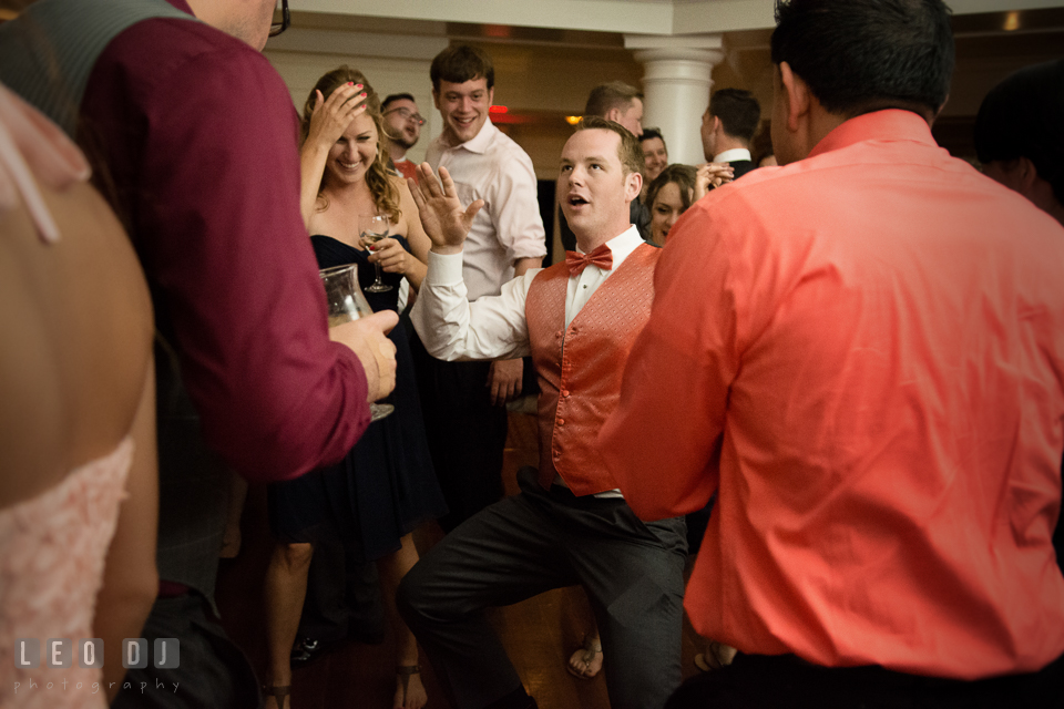 Groomsmen showing silly dance, guests laughing. Kent Manor Inn, Kent Island, Eastern Shore Maryland, wedding reception and ceremony photo, by wedding photographers of Leo Dj Photography. http://leodjphoto.com