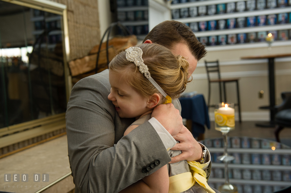 Groom hugging flower girl. Maryland Yacht Club wedding at Pasadena Maryland, by wedding photographers of Leo Dj Photography. http://leodjphoto.com