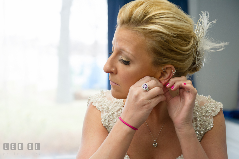 Bride getting ready and putting on earrings. Maryland Yacht Club wedding at Pasadena Maryland, by wedding photographers of Leo Dj Photography. http://leodjphoto.com