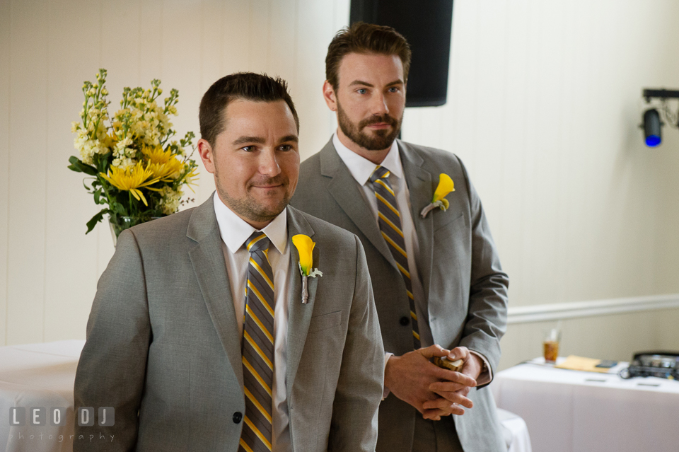 Groom accompanied by Best Man seeing Bride for the first time. Maryland Yacht Club wedding at Pasadena Maryland, by wedding photographers of Leo Dj Photography. http://leodjphoto.com