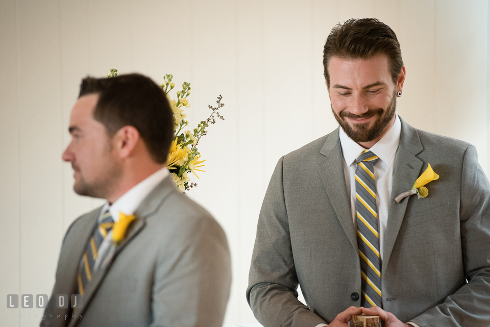 Best man smiling listening to the vows. Maryland Yacht Club wedding at Pasadena Maryland, by wedding photographers of Leo Dj Photography. http://leodjphoto.com