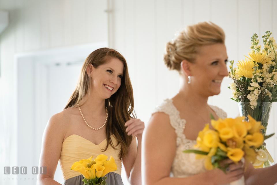 Maid of Honor laughing during the vows. Maryland Yacht Club wedding at Pasadena Maryland, by wedding photographers of Leo Dj Photography. http://leodjphoto.com