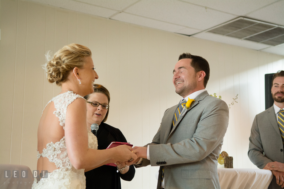 Exchanging of the wedding rings between the Bride and Groom. Maryland Yacht Club wedding at Pasadena Maryland, by wedding photographers of Leo Dj Photography. http://leodjphoto.com