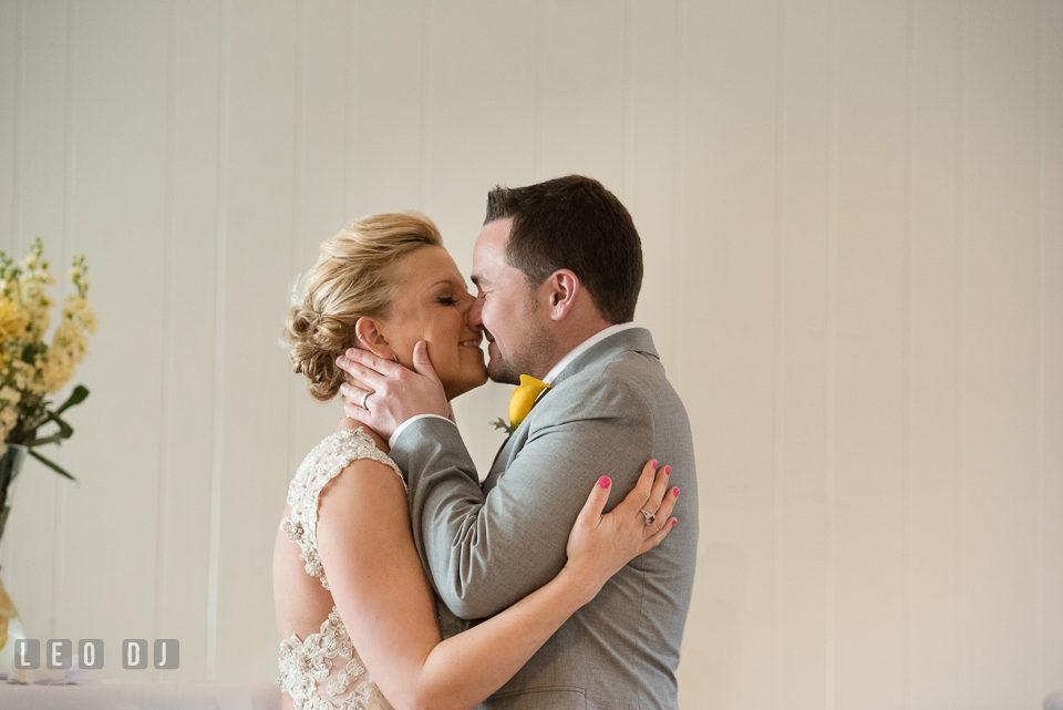 Bride and Groom's first kiss during the ceremony. Maryland Yacht Club wedding at Pasadena Maryland, by wedding photographers of Leo Dj Photography. http://leodjphoto.com