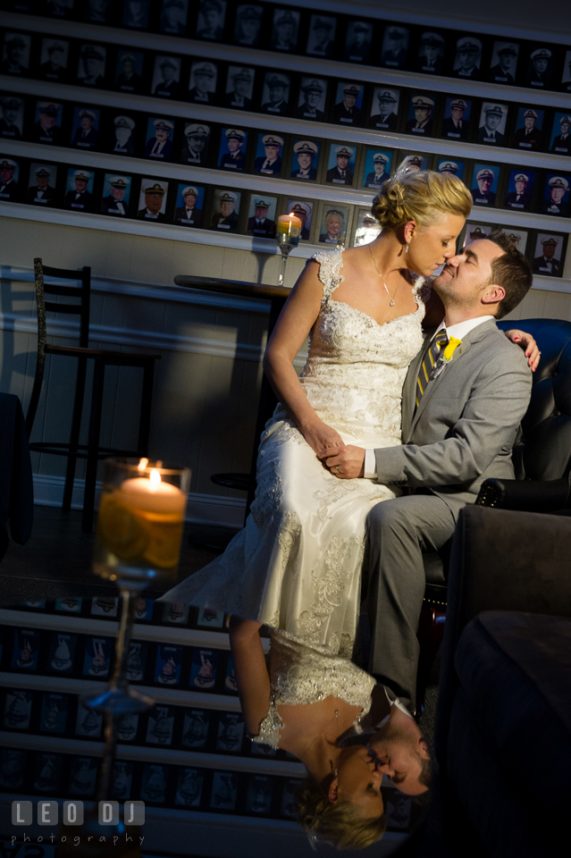 Bride and Groom sitting, cuddling and kissing. Maryland Yacht Club wedding at Pasadena Maryland, by wedding photographers of Leo Dj Photography. http://leodjphoto.com