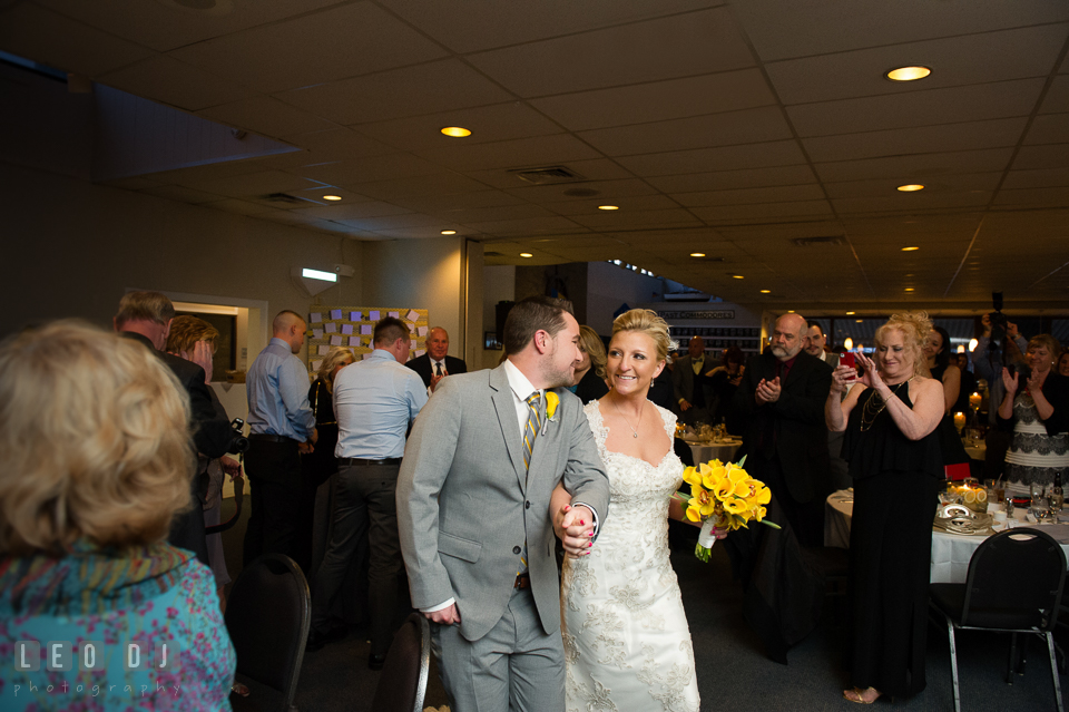 Bride and Groom entering the dining room during the introduction by the DJ. Maryland Yacht Club wedding at Pasadena Maryland, by wedding photographers of Leo Dj Photography. http://leodjphoto.com