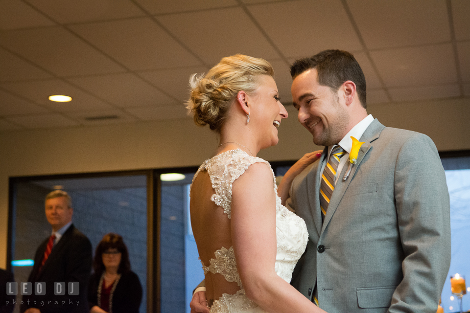 Bride and Groom smiling during the first dance. Maryland Yacht Club wedding at Pasadena Maryland, by wedding photographers of Leo Dj Photography. http://leodjphoto.com