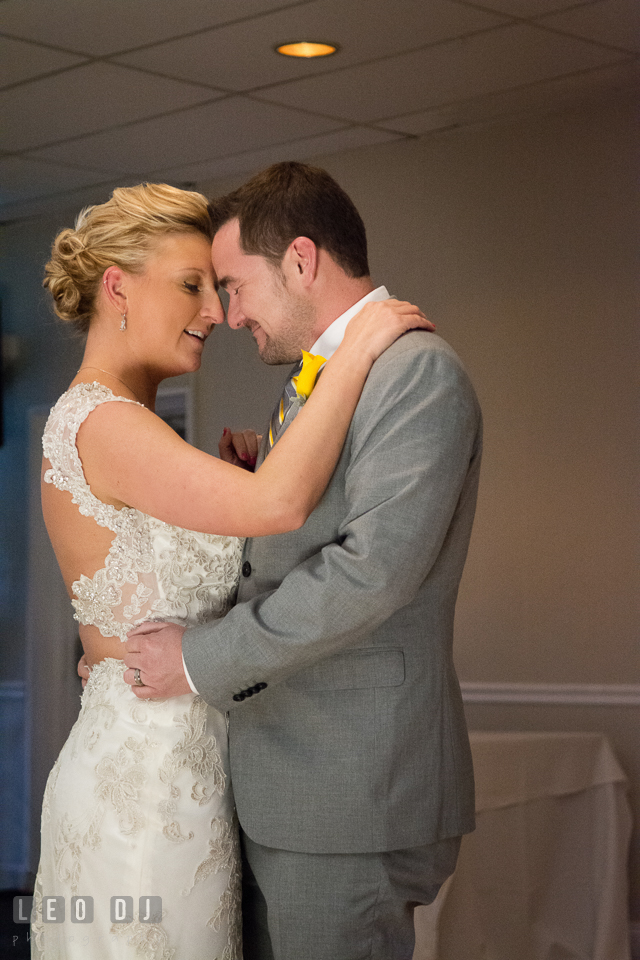 Bride and Groom embracing each other during their first dance. Maryland Yacht Club wedding at Pasadena Maryland, by wedding photographers of Leo Dj Photography. http://leodjphoto.com