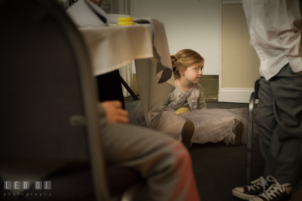 Flower girl sitting on the floor watching the Bride and Groom dancing. Maryland Yacht Club wedding at Pasadena Maryland, by wedding photographers of Leo Dj Photography. http://leodjphoto.com