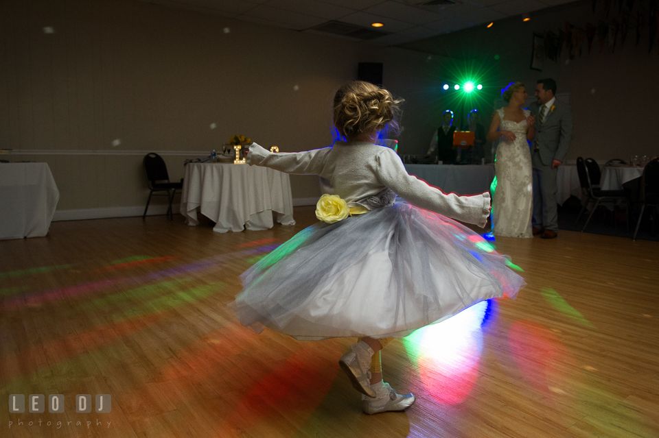 Flower girl twirling around to the song  "Let It Go" from the Disney animate movie "Frozen". Maryland Yacht Club wedding at Pasadena Maryland, by wedding photographers of Leo Dj Photography. http://leodjphoto.com