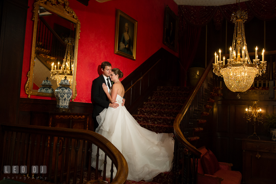 The Mansion at Valley Country Club Bride and Groom hugging on the stairs photo by Leo Dj Photography