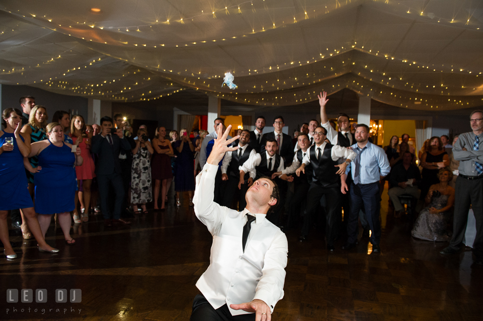 The Mansion at Valley Country Club Groom tossing garter photo