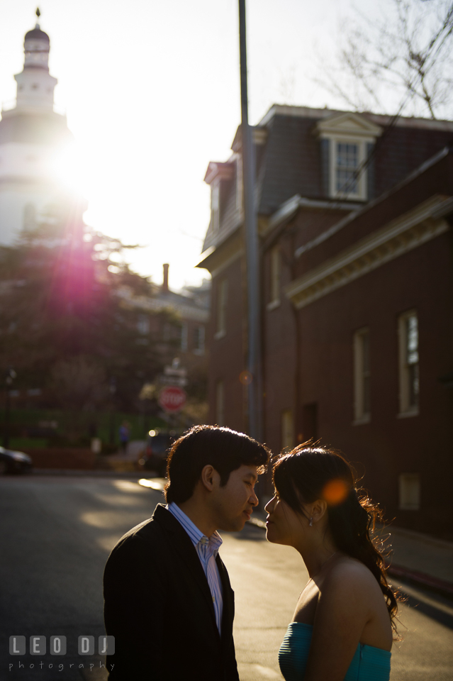 Silhouette photo of engaged girl almost kissing her fiance. Annapolis Eastern Shore Maryland pre-wedding engagement photo session at downtown, by wedding photographers of Leo Dj Photography. http://leodjphoto.com