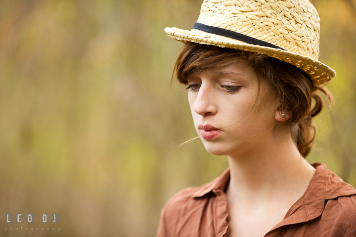 Beautiful girl with hair up-do, wearing hat, looking down. Easton, Centreville, Maryland, High School senior portrait session by photographer Leo Dj Photography. http://leodjphoto.com