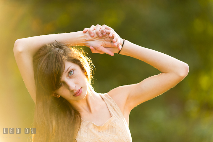 Beautiful girl resting her hands over her head. Easton, Centreville, Maryland, High School senior portrait session by photographer Leo Dj Photography. http://leodjphoto.com