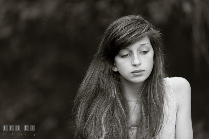 Beautiful girl with long hair looking down. Eastern Shore, Maryland, High School senior portrait session by photographer Leo Dj Photography. http://leodjphoto.com