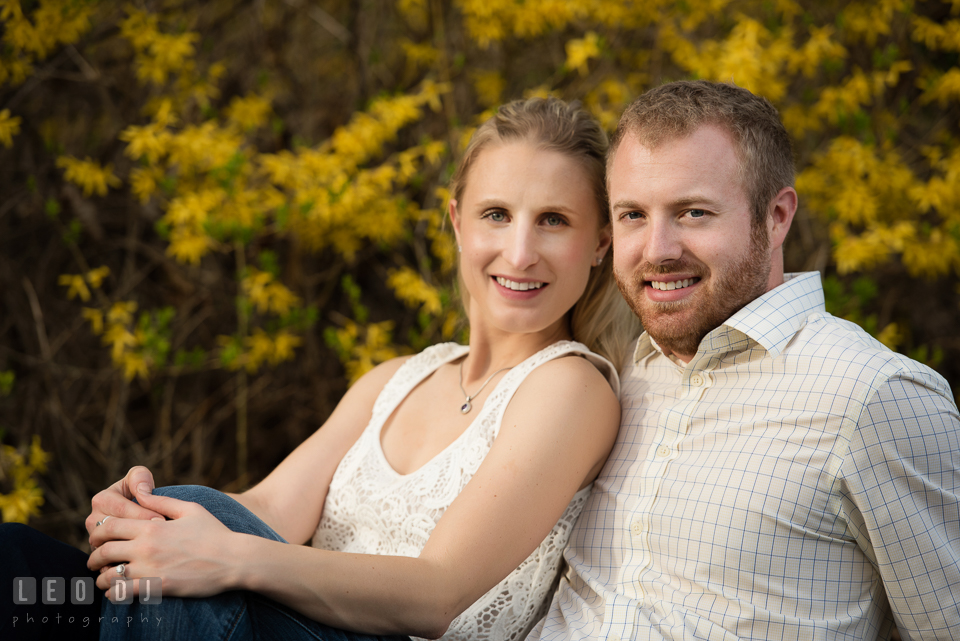 Engaged couple posing and smiling together. Quiet Waters Park Annapolis Maryland pre-wedding engagement photo session, by wedding photographers of Leo Dj Photography. http://leodjphoto.com